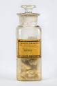stoppered glass bottle of bee's wax