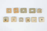 birefringent specimens mounted on square cork slides